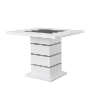 Perfect for a kitchen nook or a smaller dining space, the Elizaveta counter height dining table will fulfill all your dining needs. The white high gloss finish blends in perfectly with the glimmering faux diamond inlay base. The tabletop features silver a