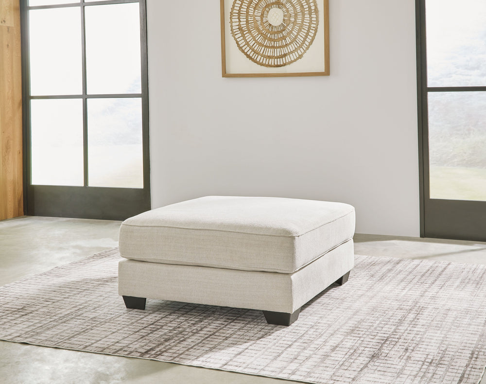 Delightfully modern. Exceptionally comfortable. If casually cool elegance is the look you-'re going for, this ottoman pleases in striking style. A plush top invites you to kick back and stay a while. Elevated in design, this companion piece is sure to be 