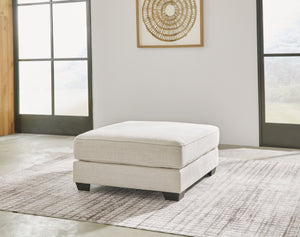  this ottoman pleases in striking style. A plush top invites you to kick back and stay a while. Elevated in design