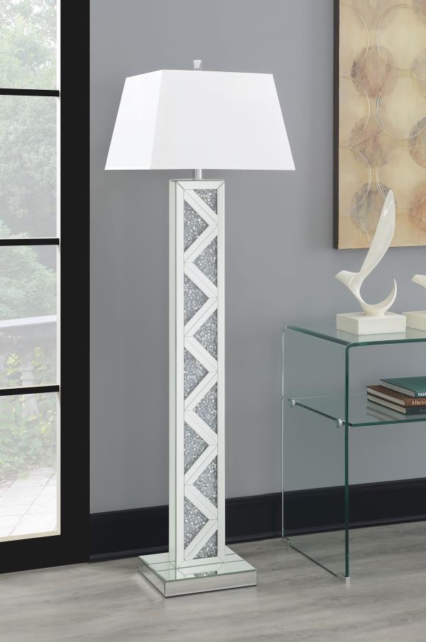  featuring a mirrored base adorned with sparkling crystal-like accents in a striking geometric pattern. A crisp white fabric shade adds contrast and diffuses soft ambient light. Perfect