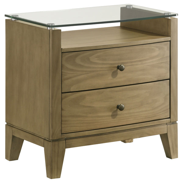 This nightstand is a perfect blend of style and functionality, featuring a natural pine finish that exudes a warm and inviting aura. Its top drawer offers cord management access, ideal for recharging devices conveniently. The piece-'s softly curved fronts