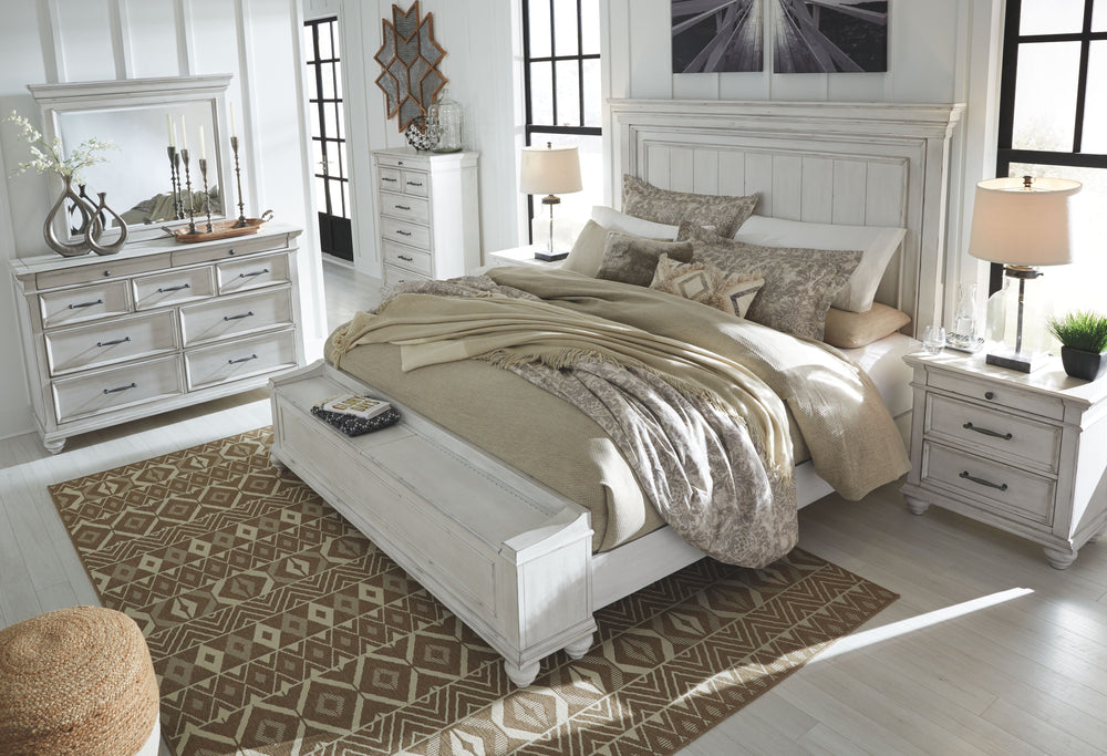 Give your retreat vintage charm with this king panel bed and storage footboard. In a beautifully distressed whitewash finish, you-'ll love the headboard-'s grand style featuring a picture framed panel. The bench footboard is equally elegant offering extra