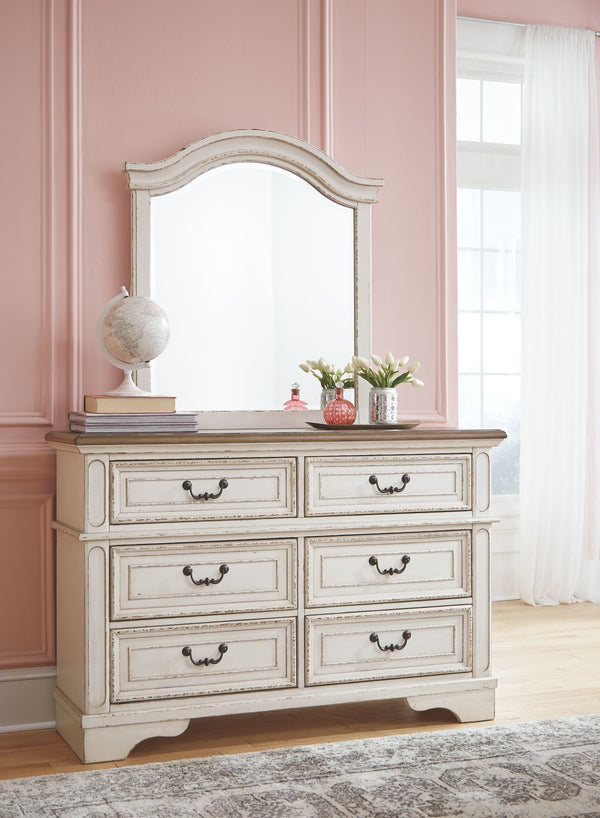 Elevating the art of traditional cottage styling, this dresser and mirror set is your dream bedroom retreat realized. This brilliantly crafted bedroom ensemble wows with dramatic scalloped details and an antiqued two-tone aesthetic, blending a chipped whi