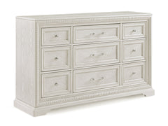 Introducing a bedroom collection that brings a breath of fresh sophistication to any living space. This suite boasts a bright, antique white finish that immediately brightens and opens up a room, providing a versatile foundation for any decor style. The b