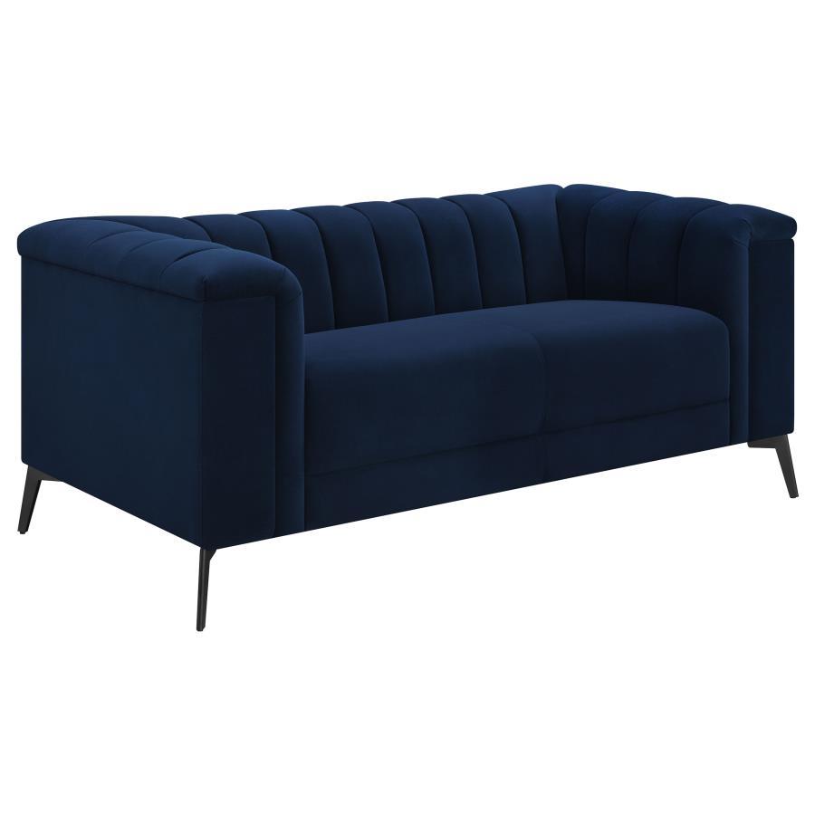 This elegant transitional loveseat will bring a palpable radiance to your home. It-'s upholstered in a vibrant navy blue matte velvet fabric that-'s so soft and stunning that you-'ll have to experience it to believe it. Whether you recline or sit, the ben