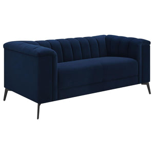 This elegant transitional loveseat will bring a palpable radiance to your home. It-'s upholstered in a vibrant navy blue matte velvet fabric that-'s so soft and stunning that you-'ll have to experience it to believe it. Whether you recline or sit, the ben