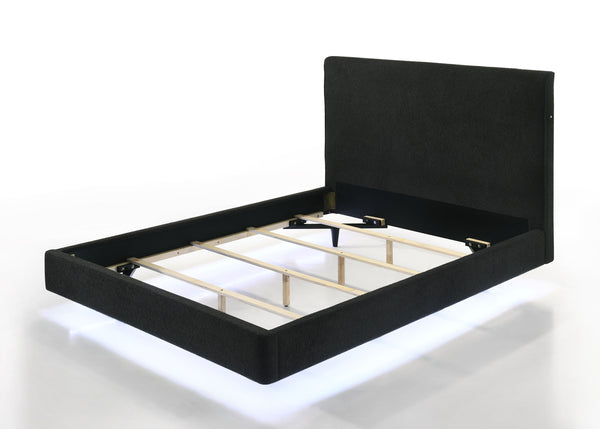  accentuated by the underbed LED lighting. The rich black upholstery presents a tranquil and inviting aesthetic. Its high headboard offers an alluring charm and p