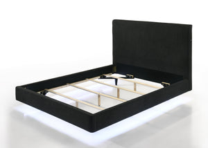  accentuated by the underbed LED lighting. The rich black upholstery presents a tranquil and inviting aesthetic. Its high headboard offers an alluring charm and p
