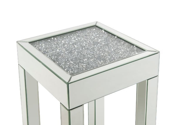  clean-lined silhouette accented by faux diamonds and mirrored finish. Adding depth and dimension to your room while upping the wow factor in your home. This Noralie End Table is ideal for displaying your precious family photos 