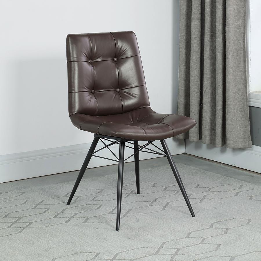 Looking to add some style to your dining room? Look no further than this charming, leatherette side chair. The beautiful brown upholstery adds warmth to a room. Decorative button tufting adds a trendy yet tasteful touch. Complete with sleek, angled legs i