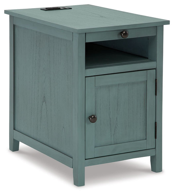 Add big character to a small space with this chairside end table. With its compact size and strong silhouette, it can go anywhere and blend easily into the decor. Less is so much more with the Shaker-inspired design and teal wood tone finish. Loaded with 