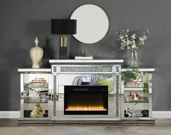 Framed with glimmering faux diamonds and encased by brilliant mirrors. The Noralie LED fireplace is sure to wow everyone. The lighted bookend shelves provide ample storage for reading materials, media accessories, or pottery. Control from anywhere in the 