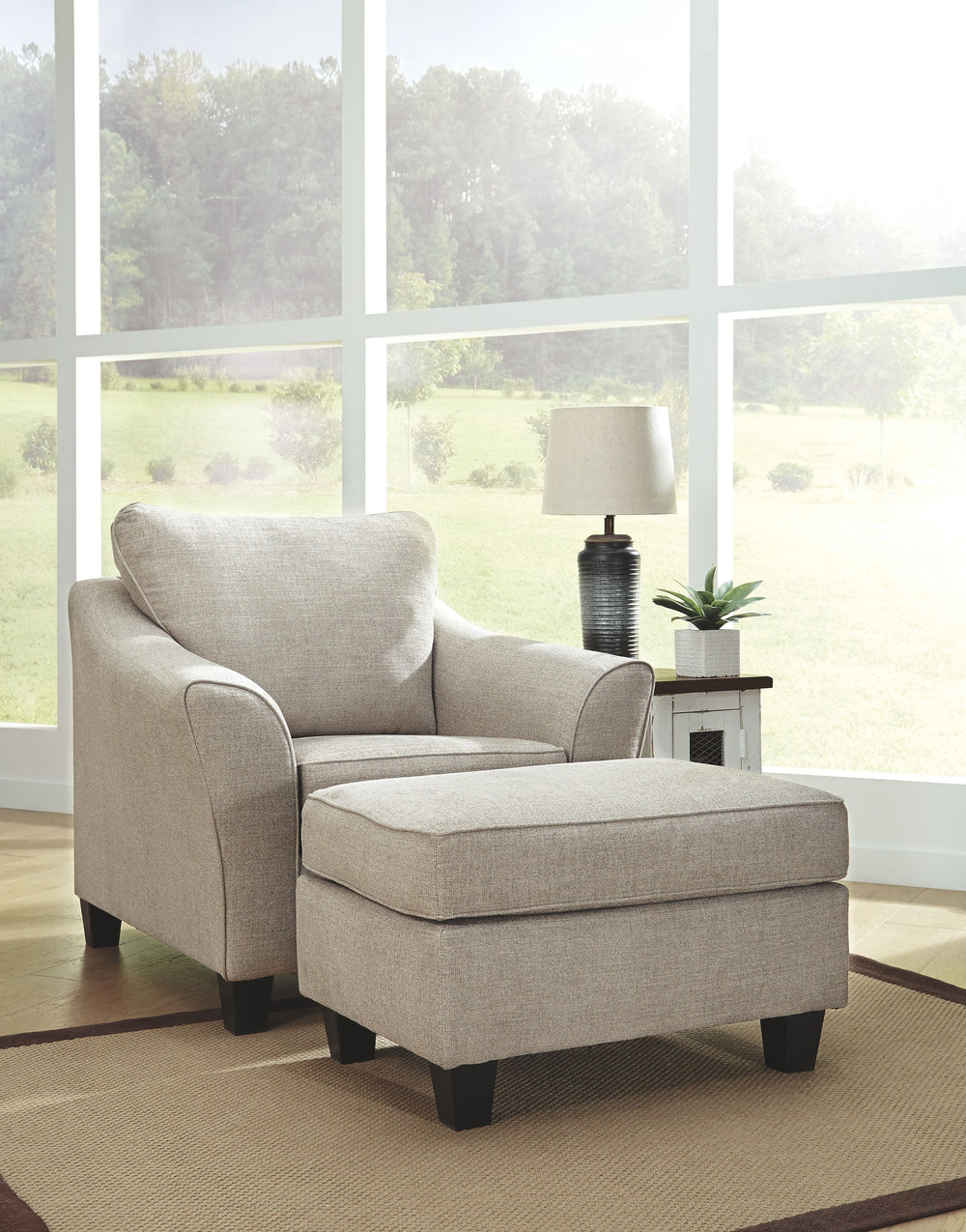 For a fresh spot in your space, turn to this designer chair and ottoman. Wind down at the end of a long day when you sink into this canyon of comfort. <h4><b>Abney - Driftwood - Chair</b></h4> <table width=-"100%-"><colgroup><col style=-"width: 30%