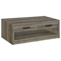 Enhance your living space with this rustic yet contemporary coffee table. Featuring a gray driftwood finish over engineered wood and scratch-resistant veneer, it boasts a natural wood-look design with realistic grain accents. The table includes two drawer