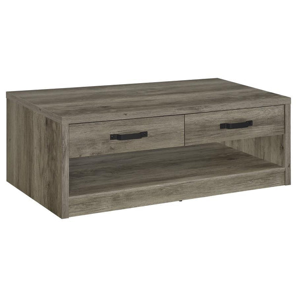 Enhance your living space with this rustic yet contemporary coffee table. Featuring a gray driftwood finish over engineered wood and scratch-resistant veneer, it boasts a natural wood-look design with realistic grain accents. The table includes two drawer