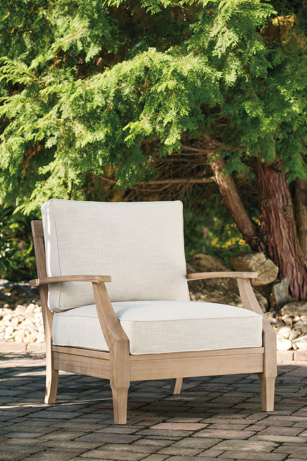 This outdoor lounge chair effortlessly pairs natural beauty with must-have durability. Its eucalyptus wood frame withstands the elements while making a high-style impression. And you can relax on the porch or poolside without the stress of added upkeepâ€”