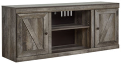 This TV stand is sure to win your heart with its daring take on modern rustic design. Its crisp, clean minimalist-chic profile is enriched with a striking replicated oak grain, thick plank styling and a rustic gray finish for that much more authentic char