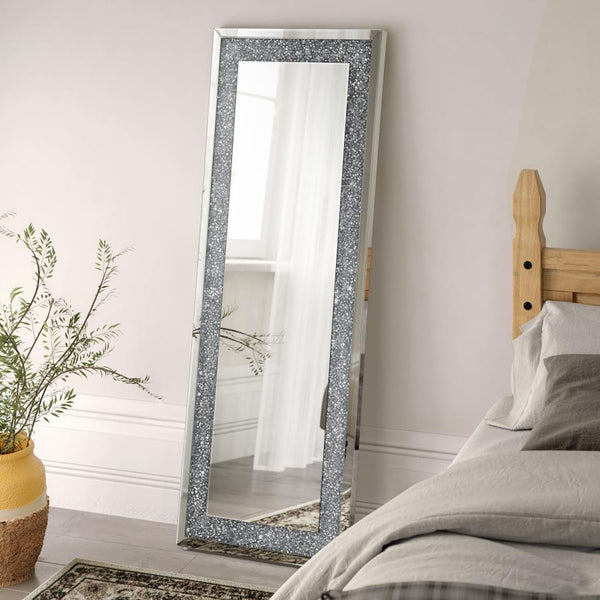  designed to impress from every angle. Its rectangular shape is framed with sparkling silver rhinestone accents and bordered by sleek mirrored trim. Ideal for bedrooms