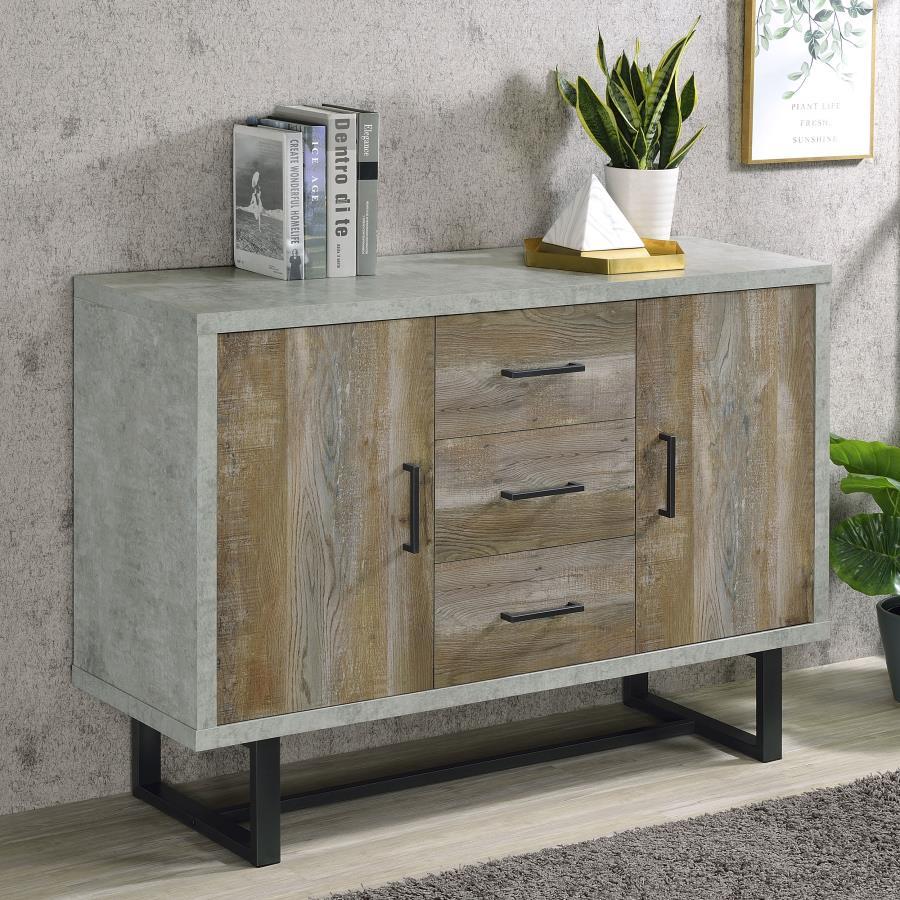 Rustic elements and industrial touches complete with overall minimal style of this contemporary accent cabinet. An outer edge of a faux cement finish reflects the gray undertones of the weathered oak drawer and cabinet panels. With a bold contrast and exp