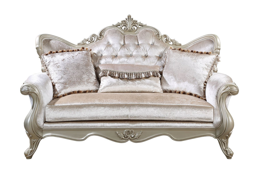 The Monique Royal Classic Loveseat in champagne exemplifies heirloom-quality craftsmanship and timeless elegance. Expertly constructed from premium pine solids and adorned with durable polyurethane carvings, this loveseat is lightweight, moisture-resistan