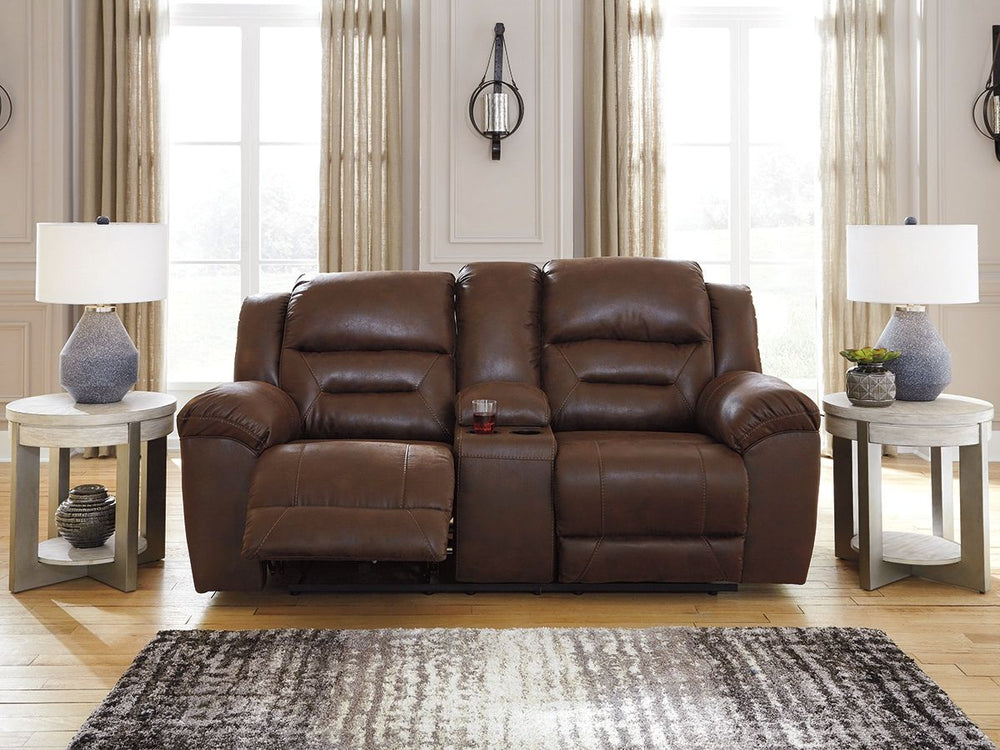 For those who love the cool look of leather but long for the warm feel of fabric, this reclining loveseat with console delivers both with ease. Its high-performance padded faux leather is remarkably durable and easy to clean, making it just the thing for 