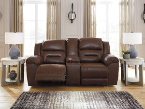  this reclining loveseat with console delivers both with ease. Its high-performance padded faux leather is remarkably durable and easy to clean