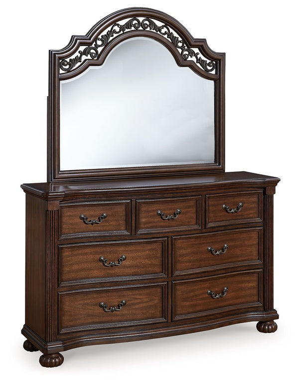 Take inspiration from the traditional luxury of this dresser with mirror. Classic with a rich cherry brown finish, its stately presence graces your room with an air of opulence. Your taste for exquisite details is satisfied with decorative drawer pulls an