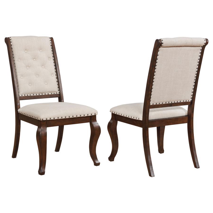 Antique java finish is a beautiful choice for this exceptional transitional dining side chair from the Brockway collection. Beautiful in any dining room, the chair offers a semi-formal, indulgent look with an upholstered, tufted back. Traced in nailhead t