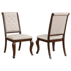 Antique java finish is a beautiful choice for this exceptional transitional dining side chair from the Brockway collection. Beautiful in any dining room, the chair offers a semi-formal, indulgent look with an upholstered, tufted back. Traced in nailhead t