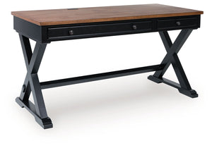 Raise the bar on modern farmhouse style with this home office desk. Its casual good looks are accentuated with a two-tone finish, which pairs a warm satin black base with a contrasting butcher block veneer desktop. The drop-down keyboard and cord manageme