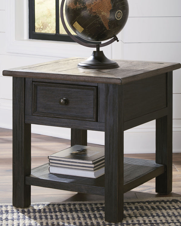  this rectangular end table is all the talk of todayâ€™s design world. Wood grain shows through the weathered gray-brown top in all of its earthy pleasure. Lovely traditional hardware adorns the framed drawer.<
