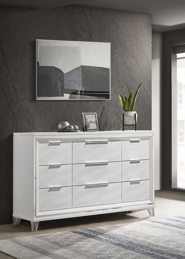 Add a touch of elegance to your bedroom with this spacious 9-drawer dresser, featuring a modern Italian design. The white finish, combined with picture framed recessed panels and embossed herringbone graphic patterns, creates a sophisticated look. Accente