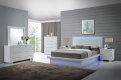 Revitalize your bedroom with the Sapphire Modern 6-Piece Bedroom Set in high gloss white. This stunning collection includes a lighted panel bed, dresser, mirror, chest, and two nightstands, all crafted from premium manufactured wood with a flawlessly smoo