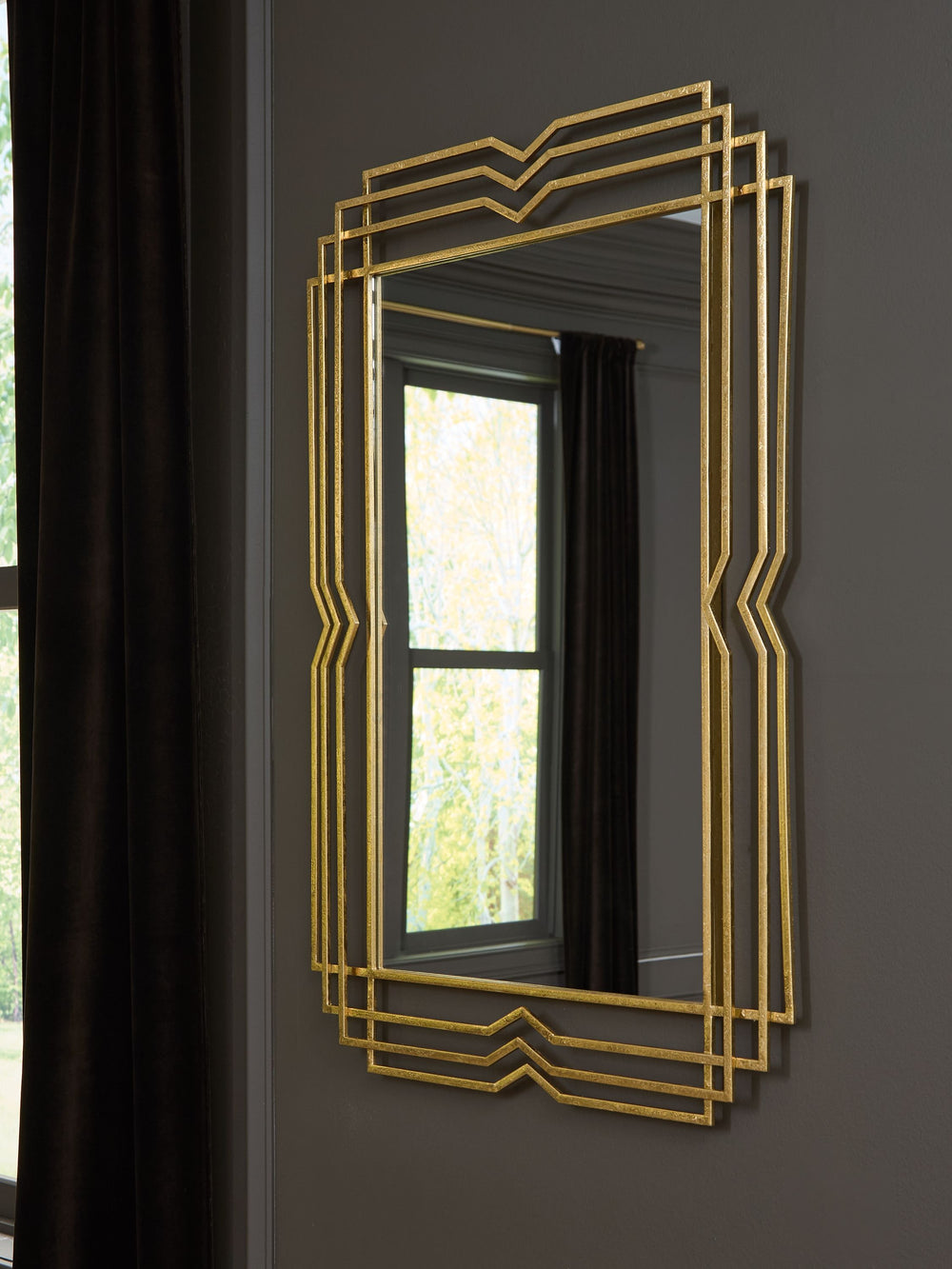 This eye-catching accent mirror elevates your home decor with its modern geometric design and glamorous gold foil finish. It-'s a stunning statement piece for an entryway, living room or bedroom, adding a touch of sophistication to brighten up your space.