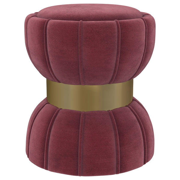 Put finishing touches on a chic decor with a modern glam ottoman. Its hourglass silhouette is playful and elegant, with a wide band highlighting in a bright gold finish. The round ottoman is a compact addition, offering a perfect spot to prop your feet. I