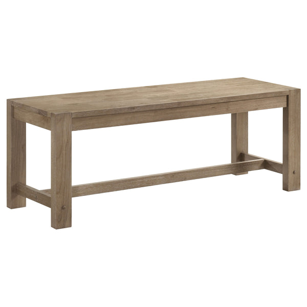 Introduce casual character with a modern farmhouse dining bench. The backless design features a trestle base detail and wooden seat, creating a simple, inviting look. It-'s crafted from Asian hardwood and features a washed brown finish. Wire brushing adds