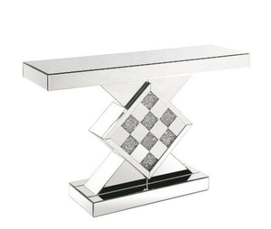 The modern glamour of the Noralie mirrored console table will brighten your foyer or bedroom. This brilliant console table features a mirrored pedestal base with faux diamond inlay, adding dimension, contrast, and shine to this functional piece. It featur