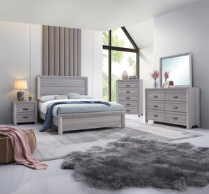 This bedroom set is the embodiment of understated sophistication, featuring a neutral drift wood finish that complements its clean and contemporary design. The robust bed frame anchors the room with a sense of sturdiness and style. Accompanying the bed ar