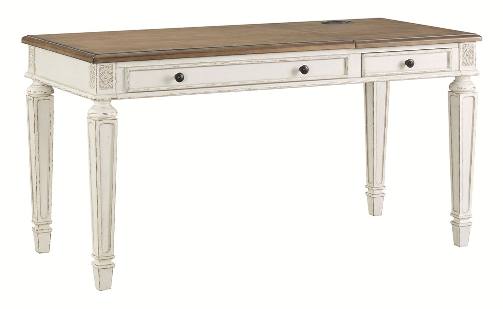 Elevating the art of traditional cottage styling, this desk is your heavenly home office realized. Its antiqued two-tone aesthetic blends a chipped white with a distressed wood tone top for added charm. Framed drawer fronts, decorative corbels and elegant