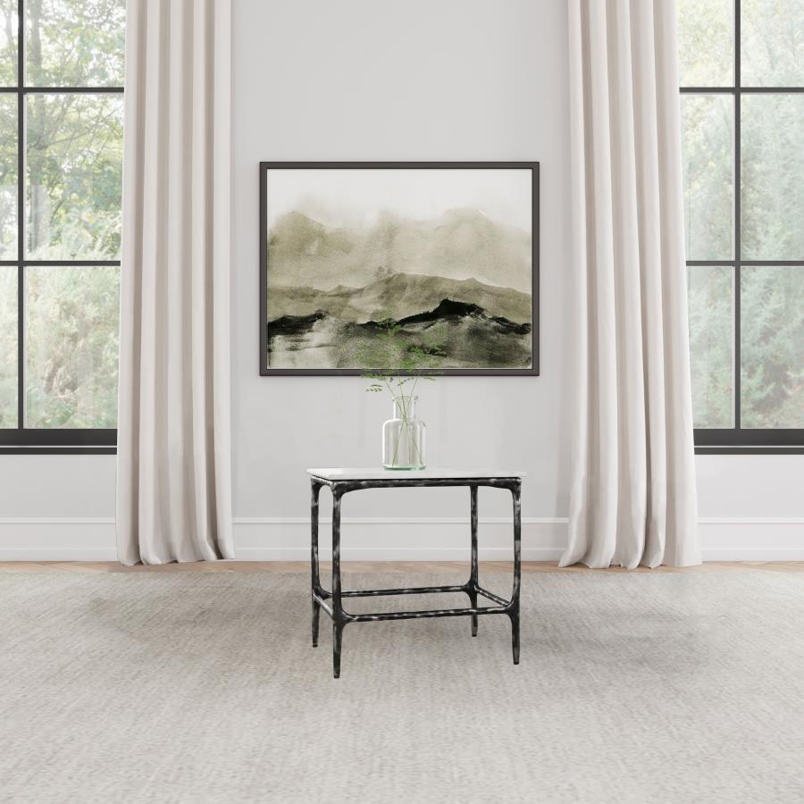 Bringing artisan appeal to the living room, this end table highlights a genuine marble surface that rests on a handcrafted iron frame with an antique black finish. Serve as a side table near a sofa or utilize as an accent table for showcasing dÃ©cor. Its 