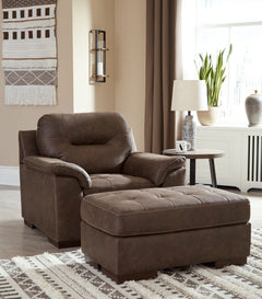 For a fresh spot in your space, turn to this designer chair and ottoman. Wind down at the end of a long day when you sink into this canyon of comfort. <h4><b>Maderla - Walnut - Chair</b></h4> <table width=-"100%-"><colgroup><col style=-"width: 30%