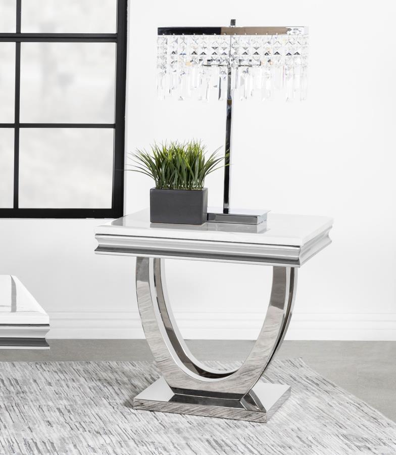 This end table combines modern glam and functional elegance with a sintered stone top featuring a marble-like appearance and beveled edges. Its sweeping demilune pedestal base in polished stainless steel provides stability while enhancing the sleek, conte