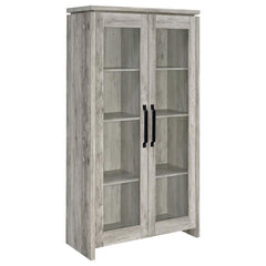 This tall curio cabinet makes for an impressive addition to a well-appointed home. The charming cabinet has classic sense of style and design. Two glass doors with contrasting dark hardware give the curio a distinguished appearance. The doors provide easy