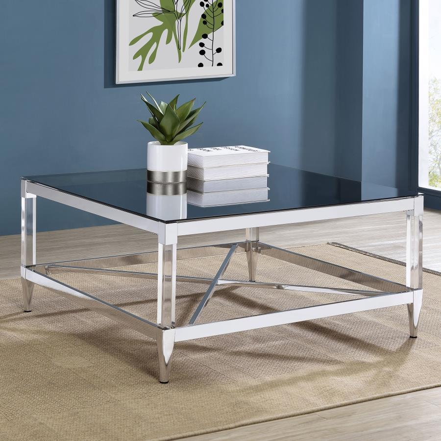 As the centerpiece of your living space, this coffee table exudes sophistication and contemporary elegance. Its square mirrored tempered glass top reflects ambient light and color, creating a vibrant focal point. The chrome-electroplated metal frame showc