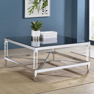  this coffee table exudes sophistication and contemporary elegance. Its square mirrored tempered glass top reflects ambient light and color