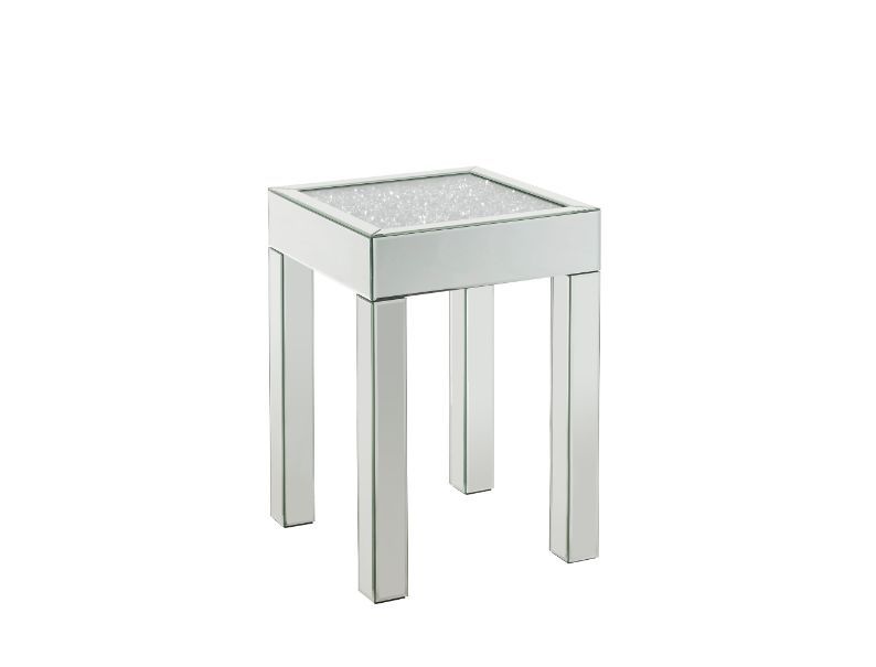 This piece strikes a sleek, clean-lined silhouette accented by faux diamonds and mirrored finish. Adding depth and dimension to your room while upping the wow factor in your home. This Noralie End Table is ideal for displaying your precious family photos 