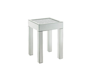 This piece strikes a sleek, clean-lined silhouette accented by faux diamonds and mirrored finish. Adding depth and dimension to your room while upping the wow factor in your home. This Noralie End Table is ideal for displaying your precious family photos 