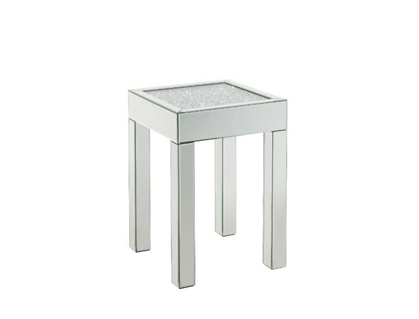 This piece strikes a sleek, clean-lined silhouette accented by faux diamonds and mirrored finish. Adding depth and dimension to your room while upping the wow factor in your home. This Noralie End Table is ideal for displaying your precious family photos 