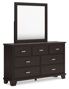 Feast your eyes on this richly versatile dresser with mirror. Its traditional-inspired dark brown finish effortlessly blends with contemporary bright nickel-tone pulls to create a stunning look that-'s not too stuffy or too trendy. Spacious drawers offer 