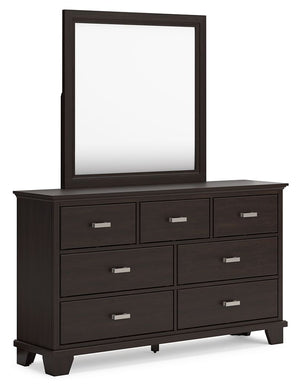 Feast your eyes on this richly versatile dresser with mirror. Its traditional-inspired dark brown finish effortlessly blends with contemporary bright nickel-tone pulls to create a stunning look that-'s not too stuffy or too trendy. Spacious drawers offer 